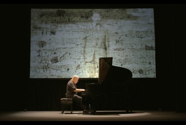 Dedication Marlyebone Theatre: Showing Roger Peltzman on stage with a piano performing Dedication