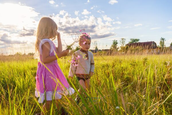 Photograph of two children in a field